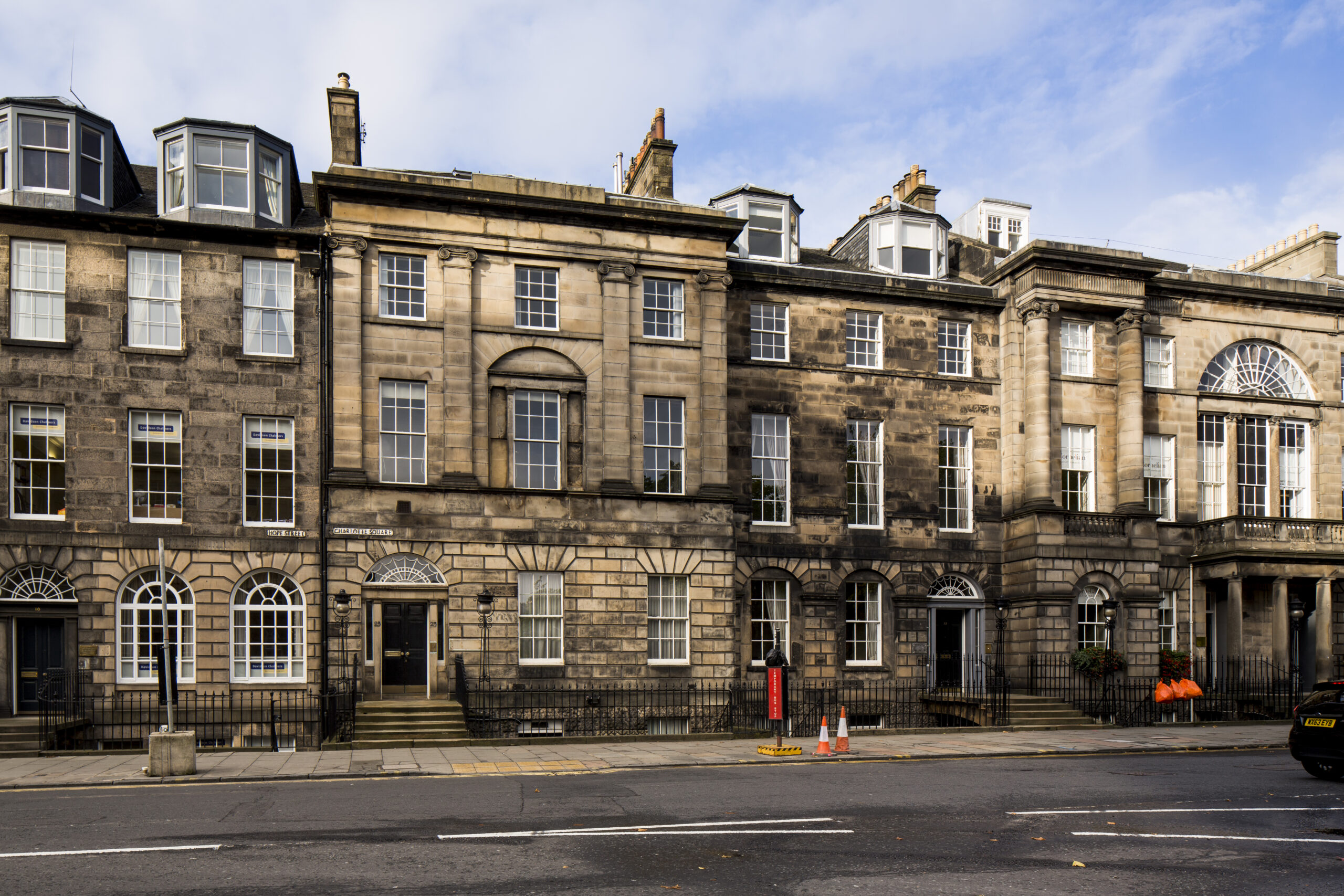 Georgian architecture on Abercromby Place, Edinburgh, with stone facades and large windows.