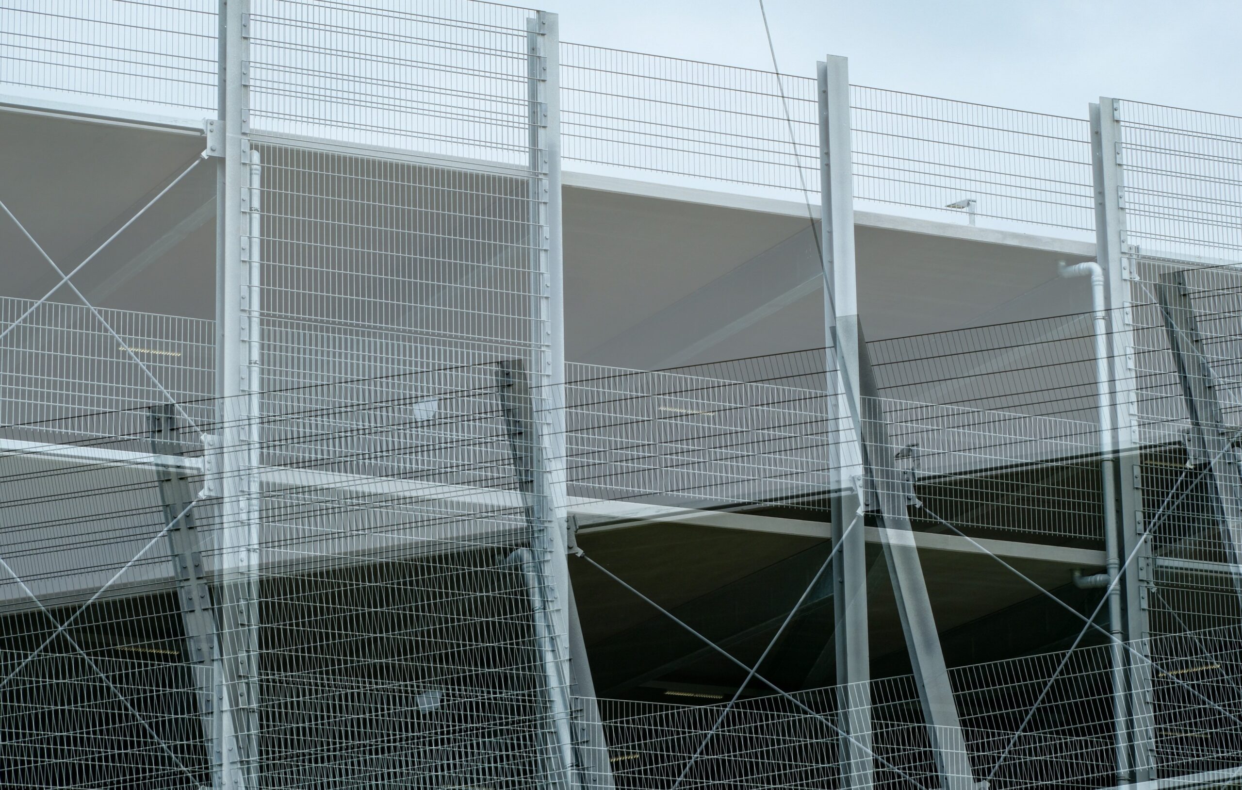 Modern commercial building structure showing grid and layered elements, representing thermal modelling and building performance analysis