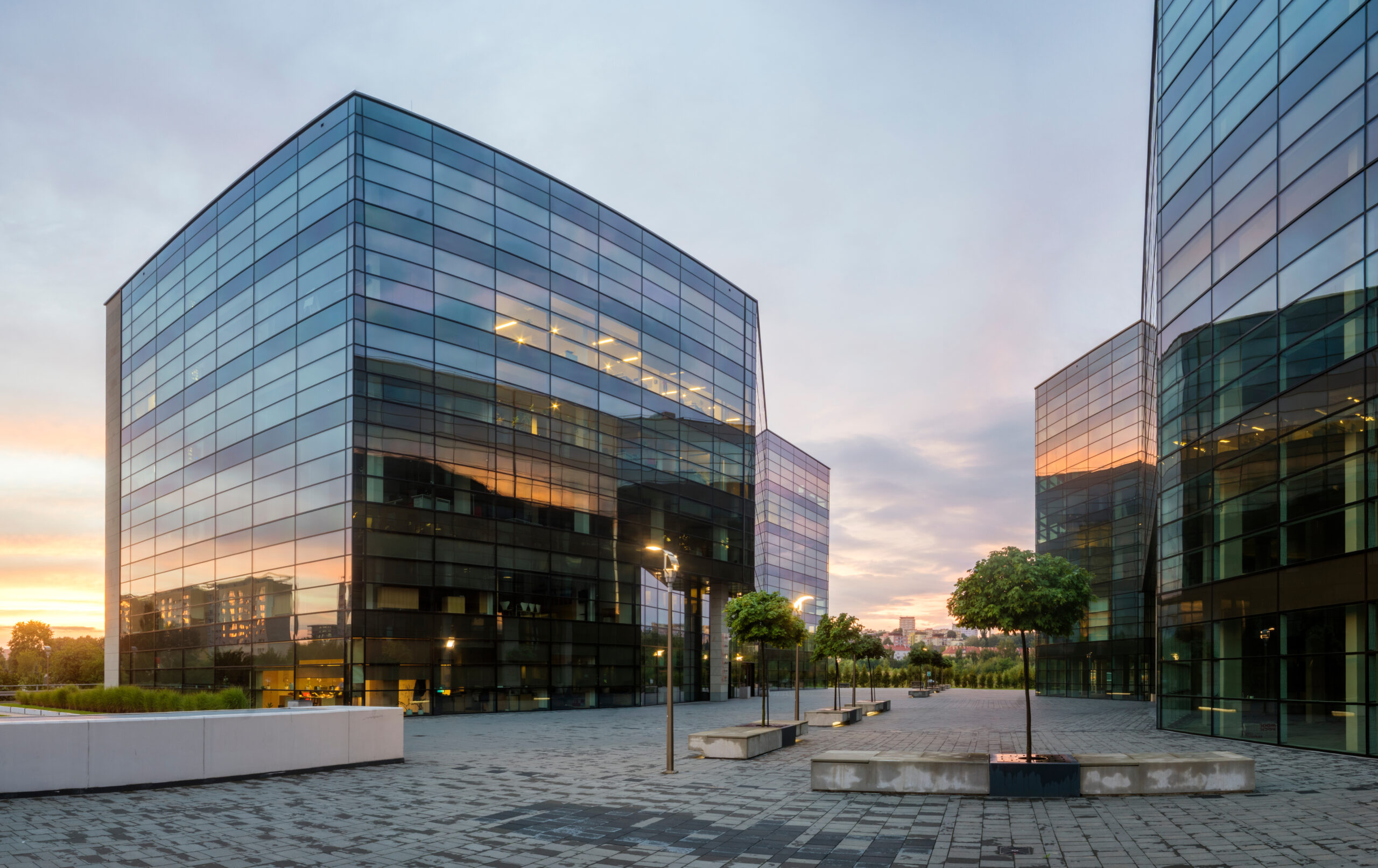 Modern commercial office buildings illustrating PAS 51215 energy and decarbonisation assessments for ESOS compliance and Net Zero planning