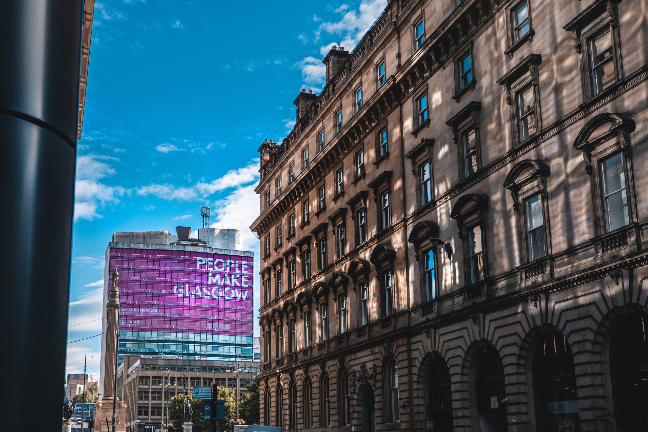Commercial buildings in Glasgow city centre with People Make Glasgow signage